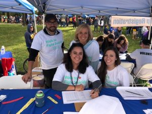TCG manning the registration table at the Association for Suicide Prevention, Out of the Darkness Walk. 