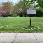 A placard in a small field honoring the park's namesake, Marvin Caplan.